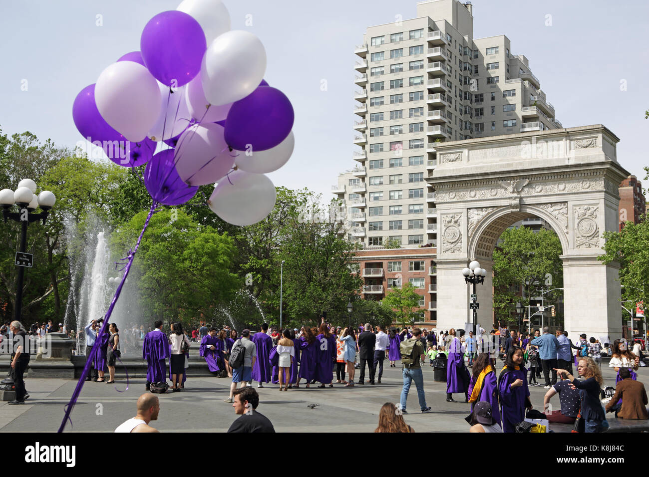 New York, NY, USA - May 16, 2017: New York University students, in caps and gowns, gather in Washington Square Park to celebrate graduation Stock Photo