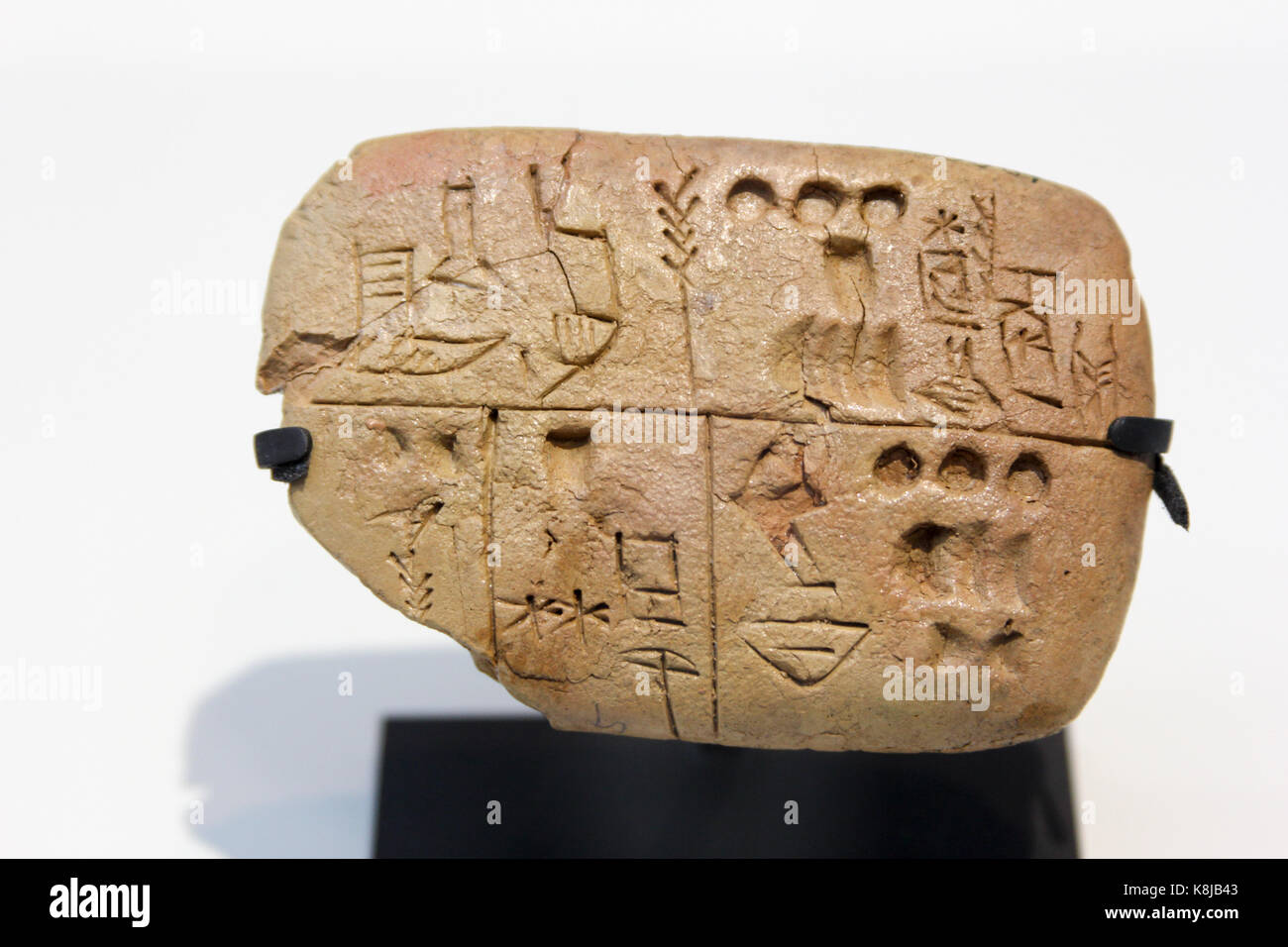 Pre-cuneiform writing clay tablet noting food rations. Archives of the Temple of the Sky God. Around 3300 BC. The Louvre Museum, Lens, France. Stock Photo