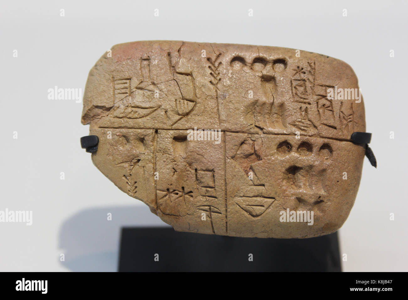 Pre-cuneiform writing clay tablet noting food rations. Archives of the Temple of the Sky God. Around 3300 BC. The Louvre Museum, Lens, France. Stock Photo