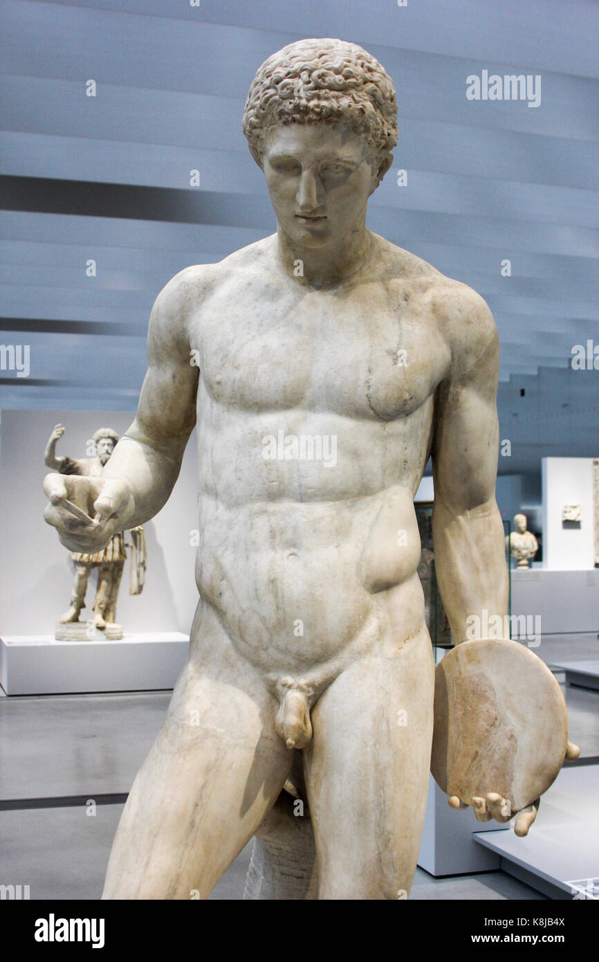 Athlete holding a discus, Roman copy of 'Discophoros' in bronze [original by Naucydes (active in 390-400 BC)]. Marble. Around 130-150 BC. Stock Photo