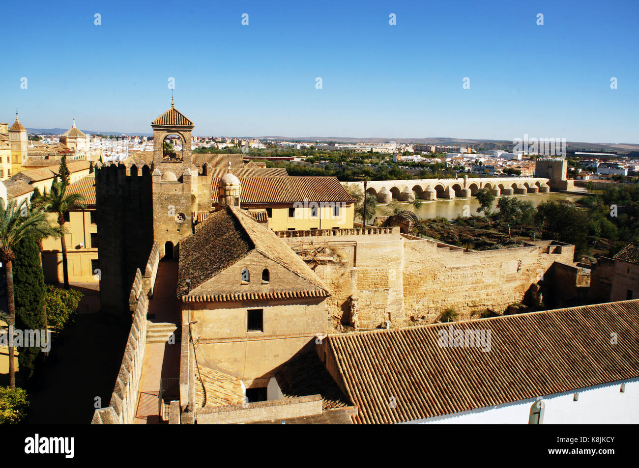 The Roofs and patio of Alcazar of the Christian Monarchs in Cordoba, Spain with bridge on Gwadalkiwir Stock Photo
