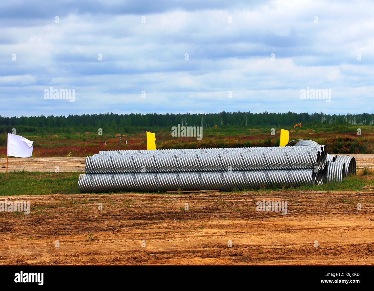 Corrugated aluminum rolls stacked at the site before construction Stock