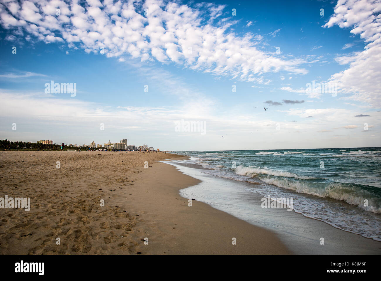 sunset at the beach with silhouettes Stock Photo - Alamy
