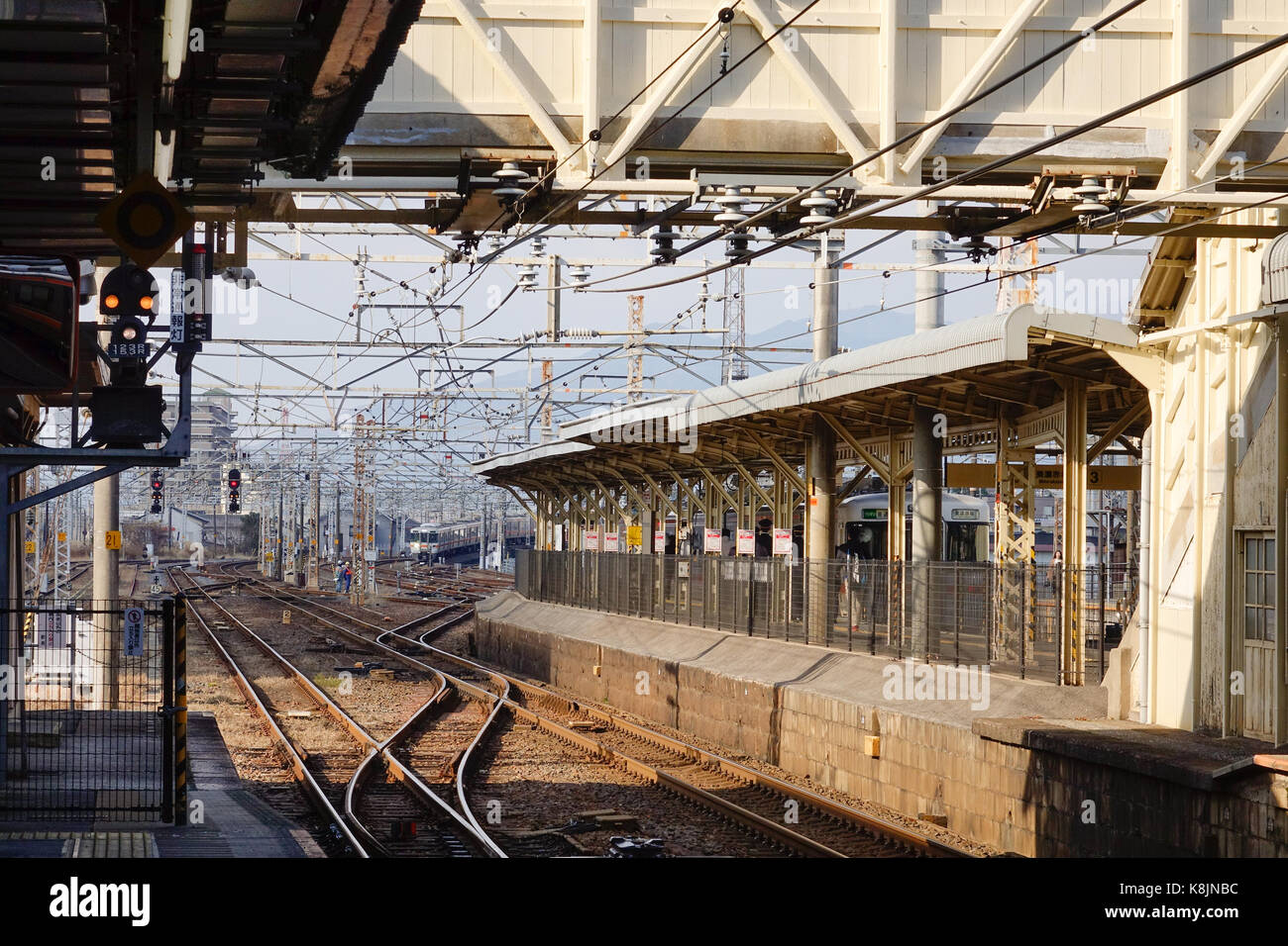 Tokyo, Japan - Dec 25, 2015. Platform with tracks at Hachioji railway station in Tokyo, Japan. Railways are the most important means of passenger tran Stock Photo