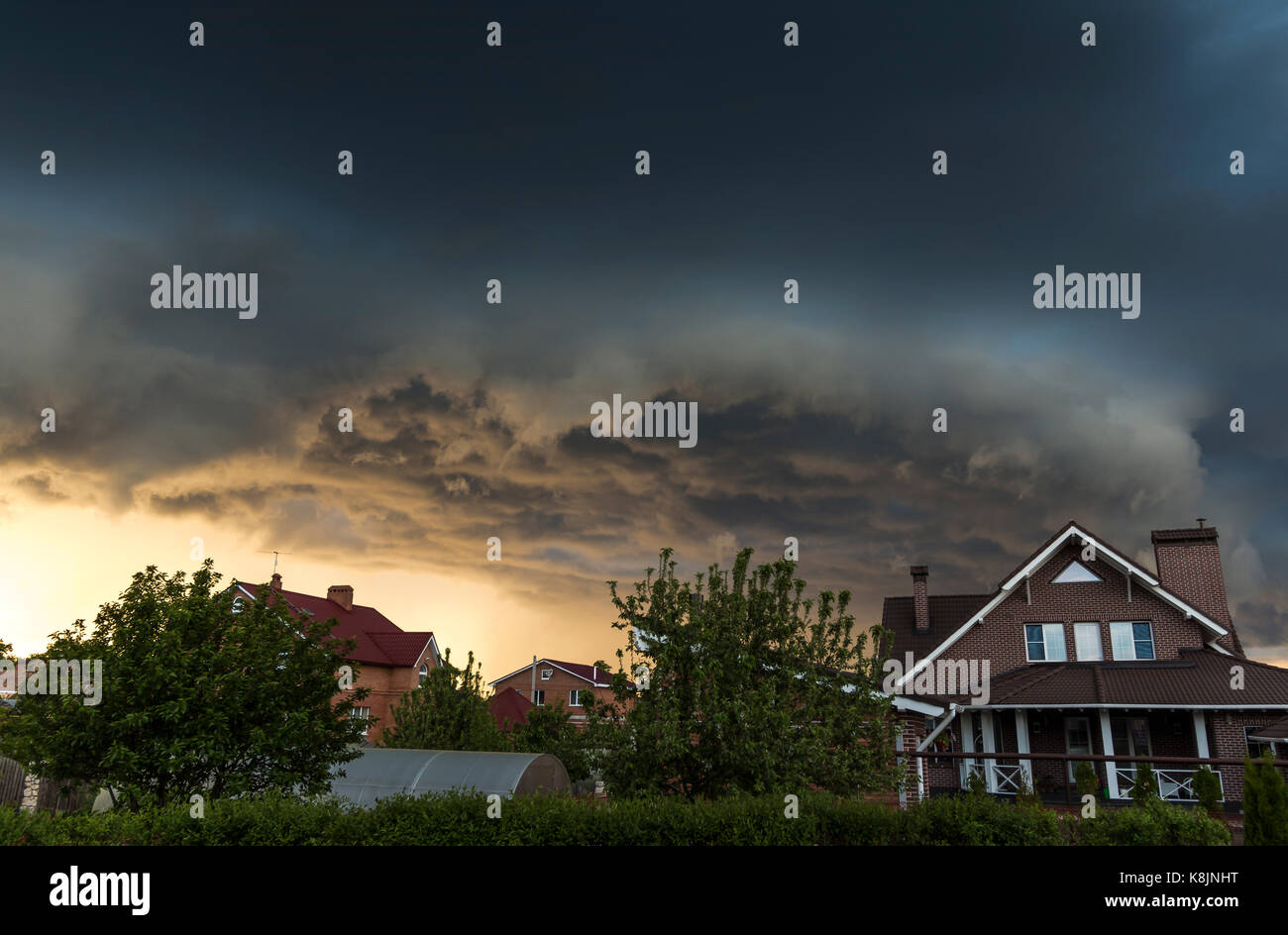 Summer storm clouds over the village Stock Photo - Alamy