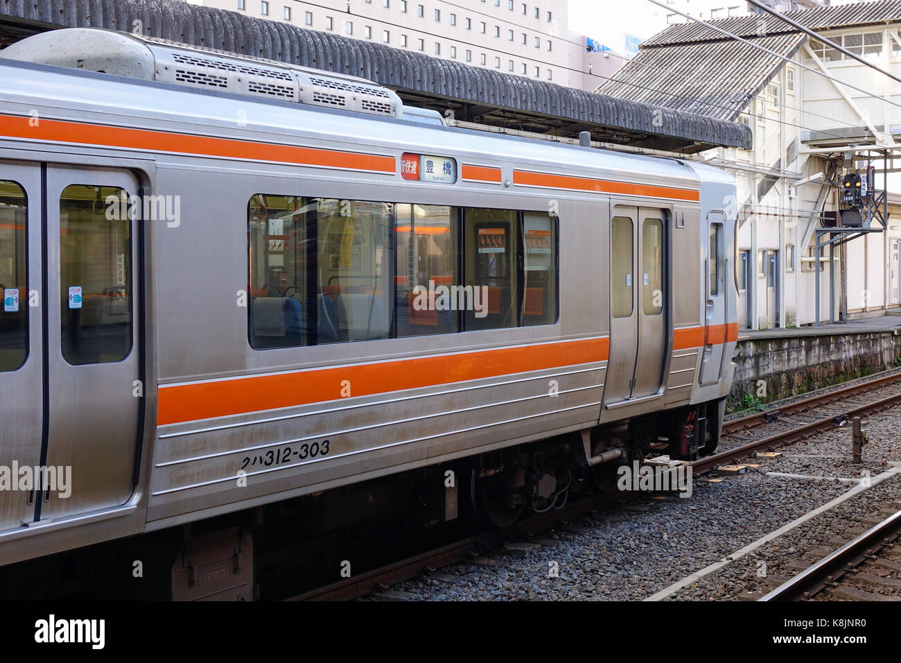 Tokyo, Japan - Dec 25, 2015. A JR train stopping at Hachioji railway station in Tokyo, Japan. Railways are the most important means of passenger trans Stock Photo