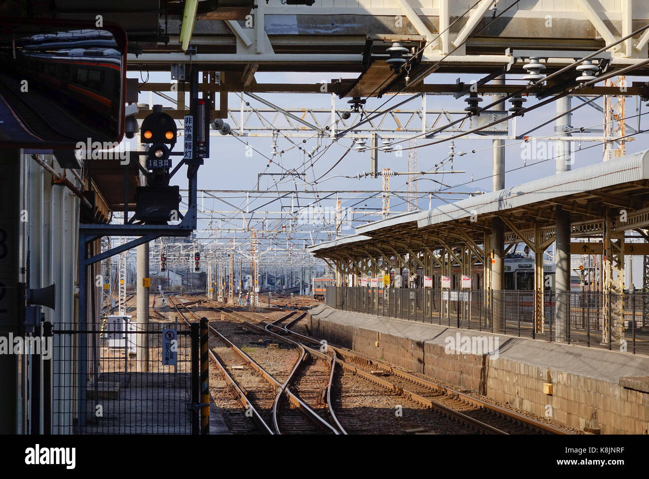 Tokyo, Japan - Dec 25, 2015. Platform with tracks at Hachioji railway station in Tokyo, Japan. Railways are the most important means of passenger tran Stock Photo
