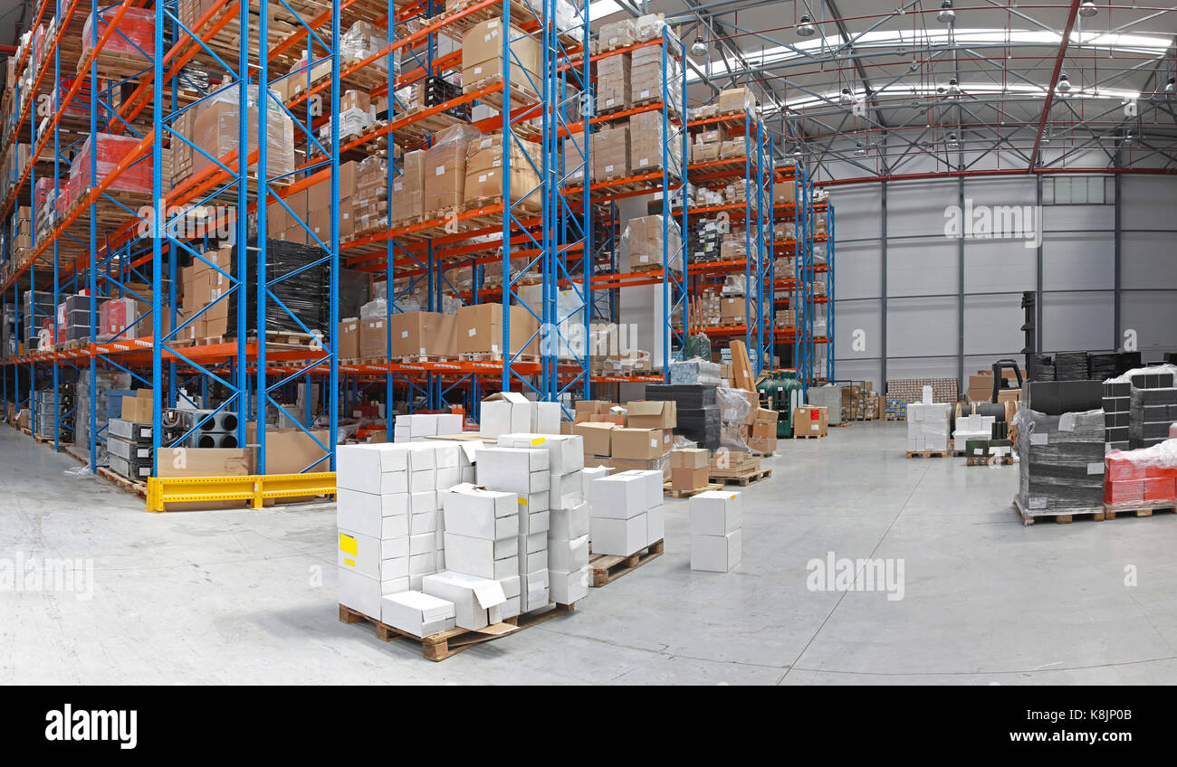 Distribution centre with high rack shelving system Stock Photo