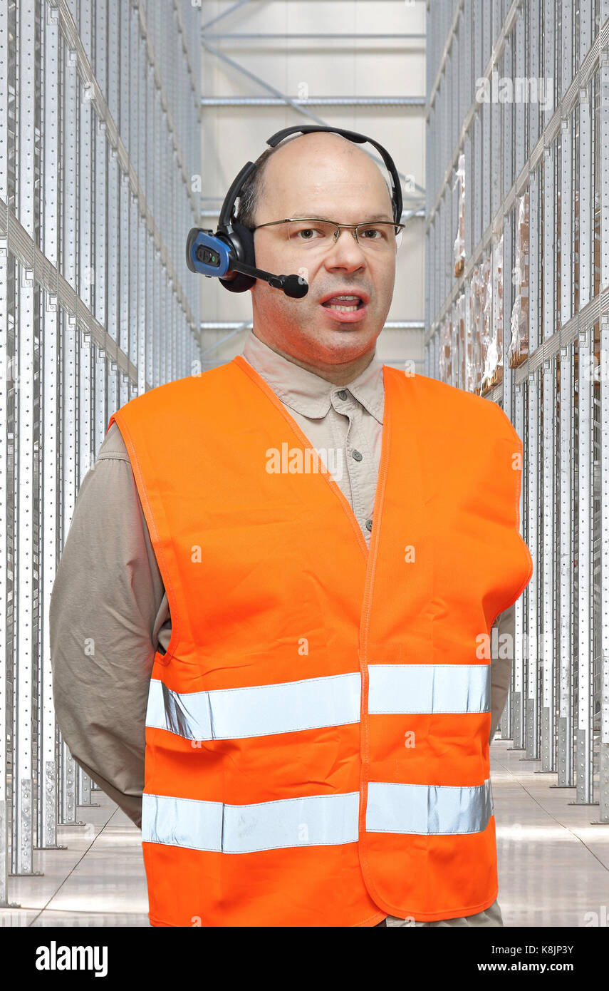 Pick by Voice Control Headset Man in Warehouse Stock Photo