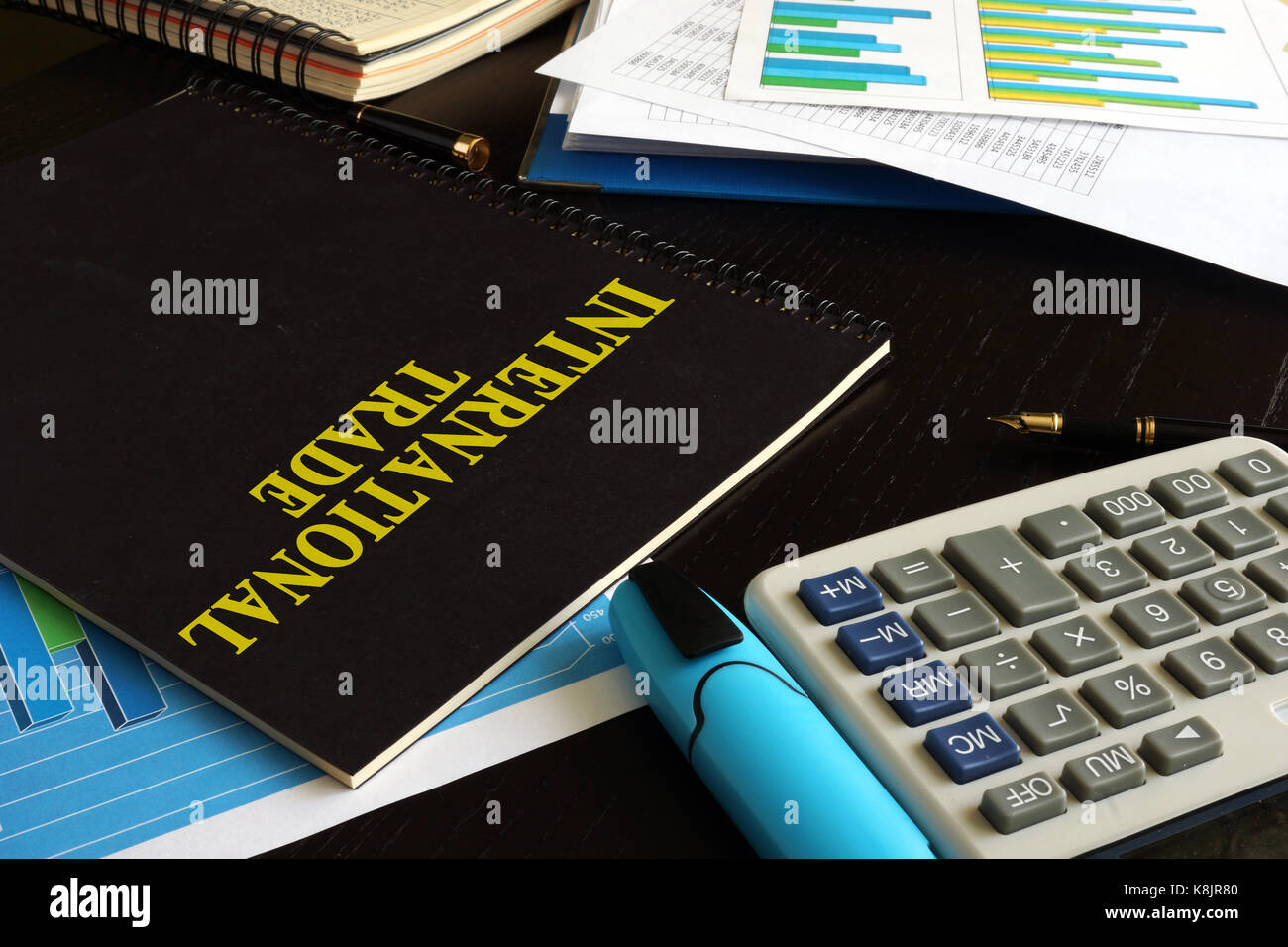 Book International trade on a table in an office. Stock Photo
