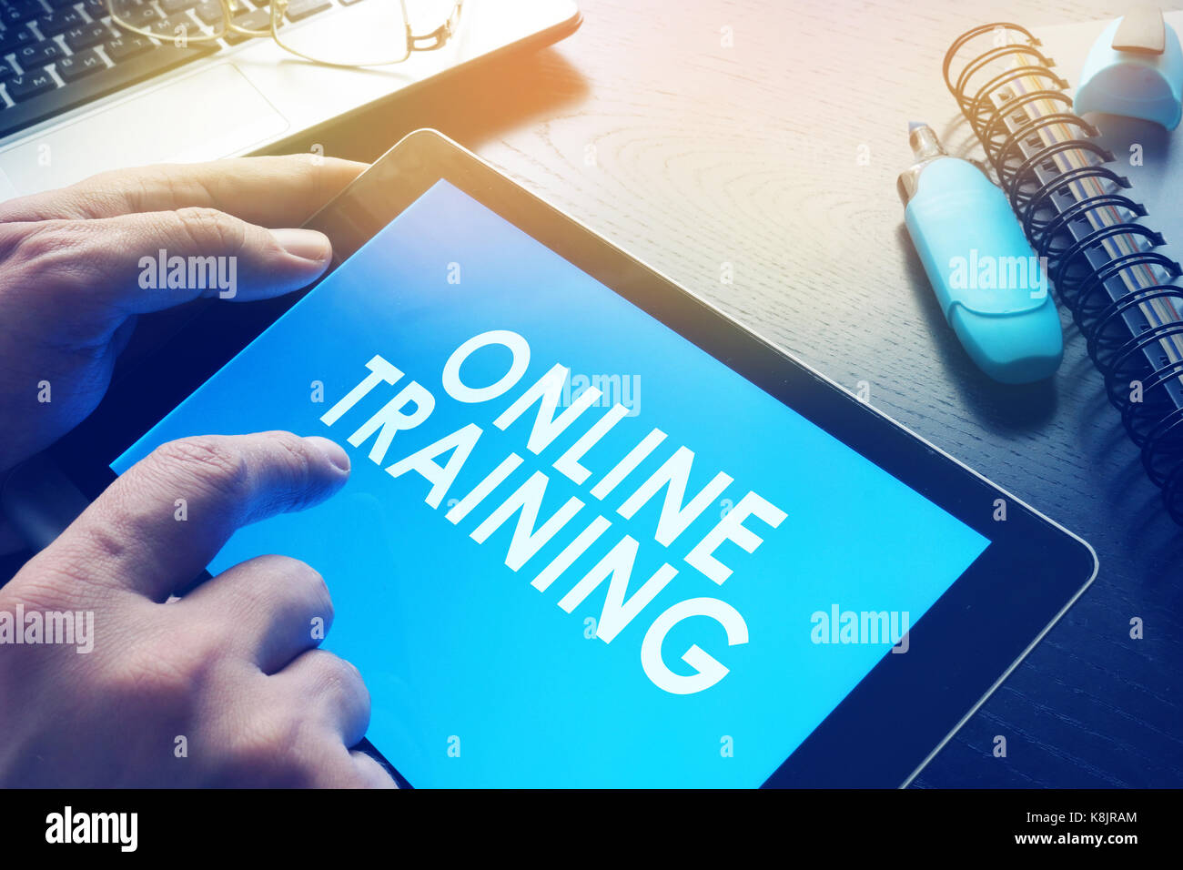 E-learning concept. Online training on a screen of tablet. Stock Photo