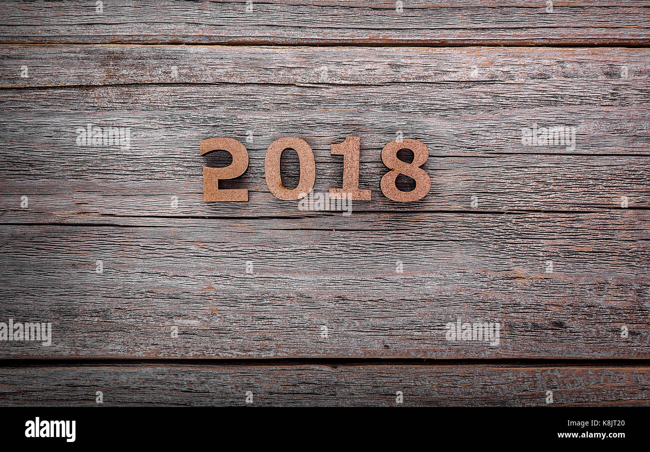 Figures 2018 on a wooden background. Stock Photo