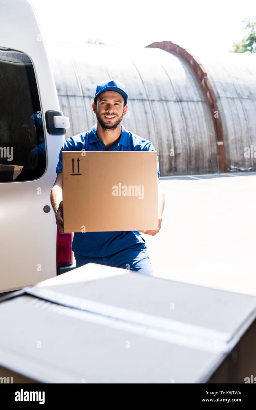 delivery man with box Stock Photo