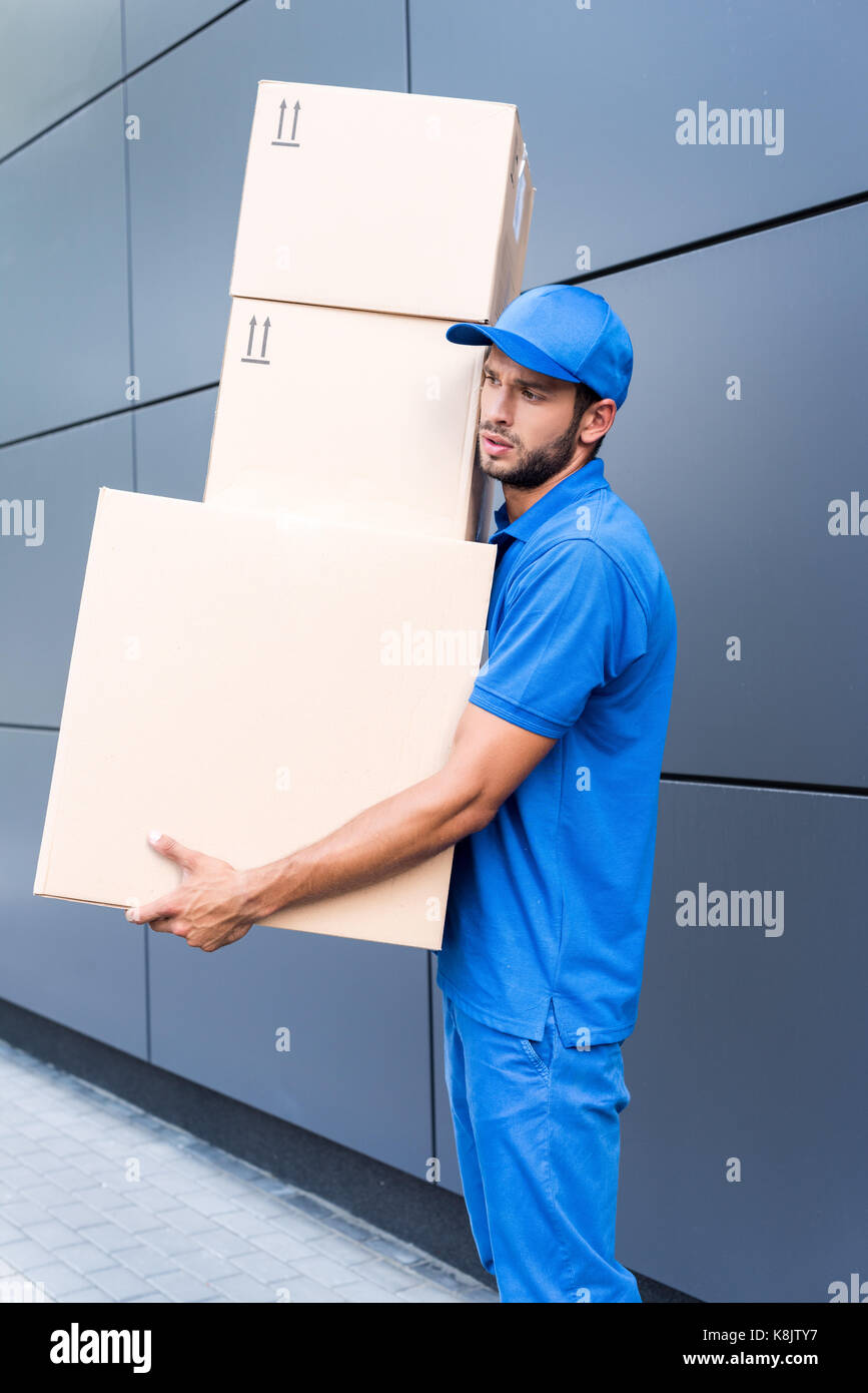 delivery man with boxes Stock Photo