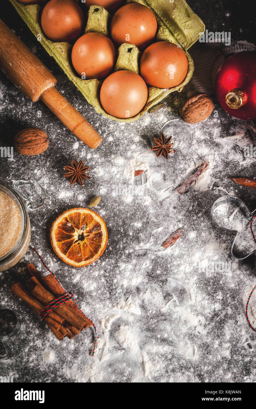 Christmas, New Year holiday cooking background. Ingredients, spices, dried  oranges and baking molds, Christmas decorations (balls, fir-tree branch, co  Stock Photo - Alamy