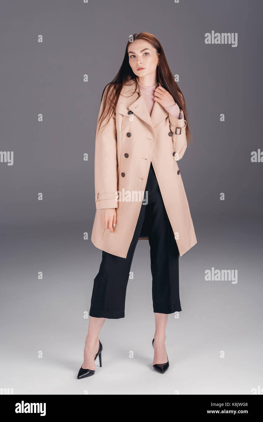 fashionable young woman in coat Stock Photo - Alamy