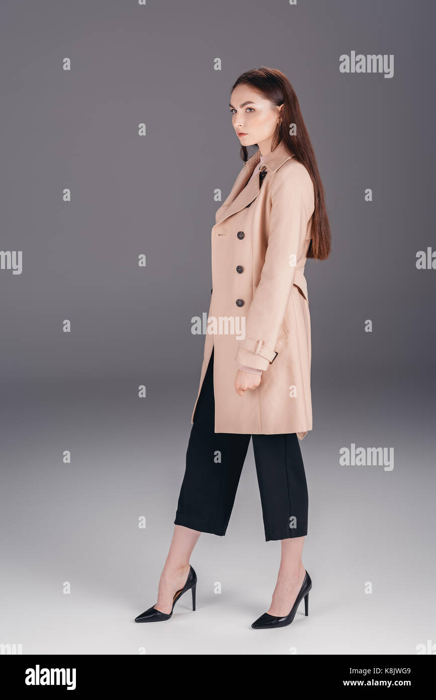 fashionable young woman in coat Stock Photo - Alamy