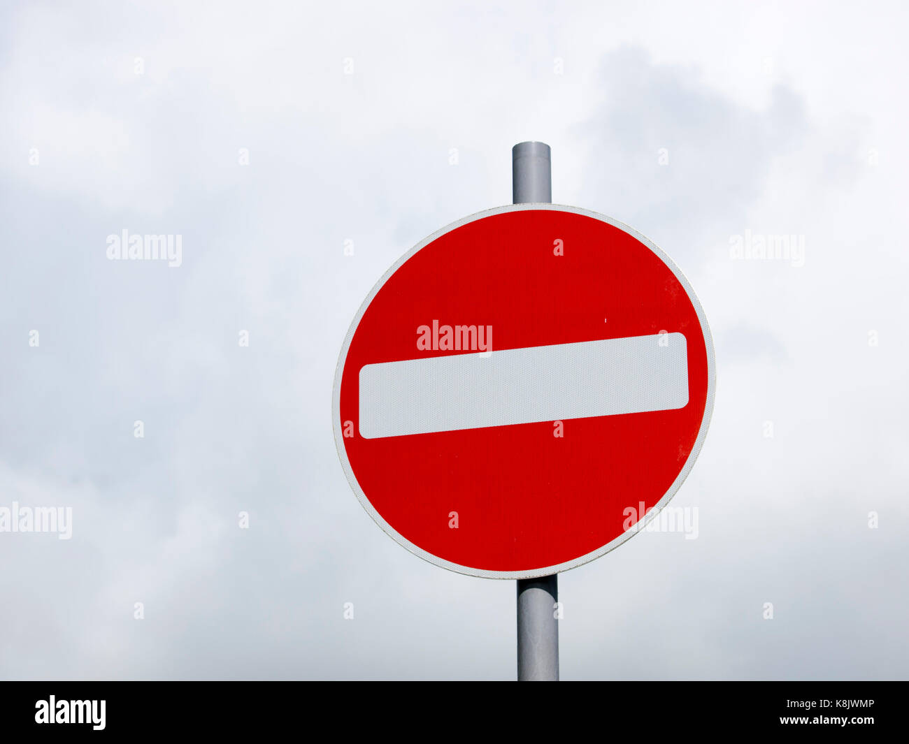 No Entry road sign UK, set against white clouds Stock Photo - Alamy