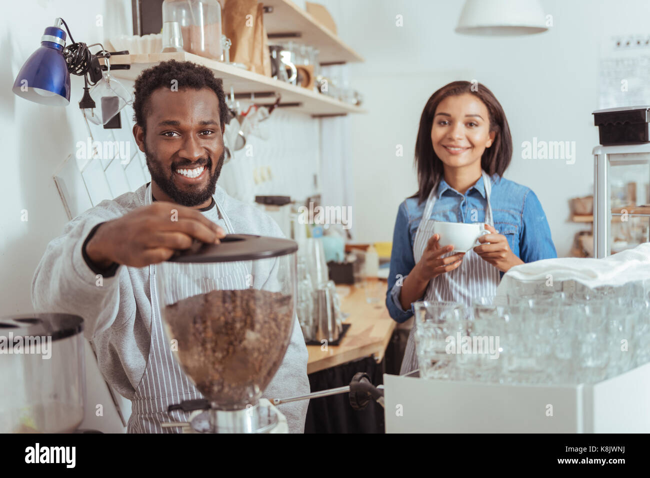 Pleasant baristas training to make coffee in the cafe Stock Photo Alamy