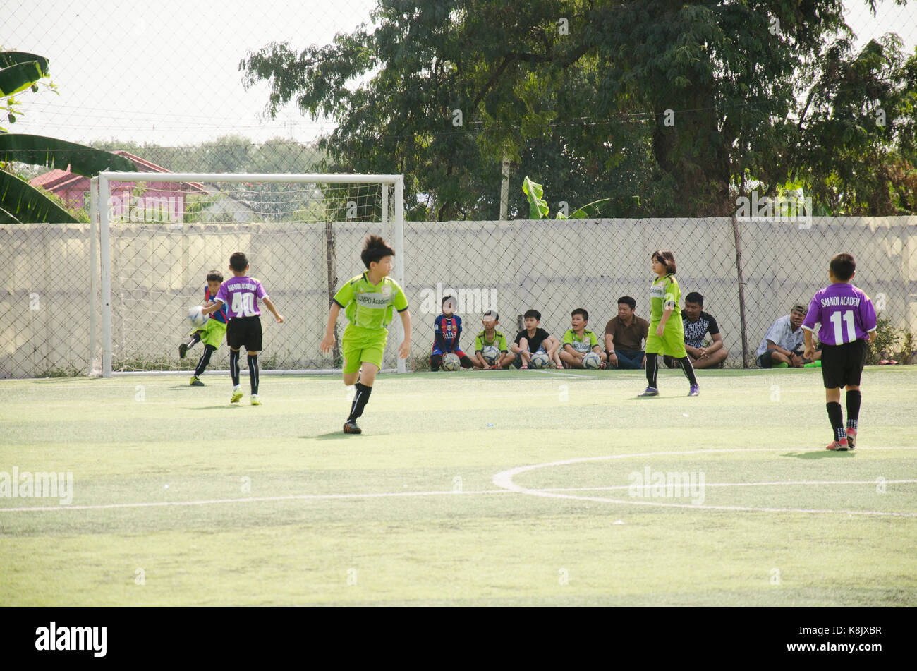 Asian thai children playing futsal in tournament at futsal pitch on