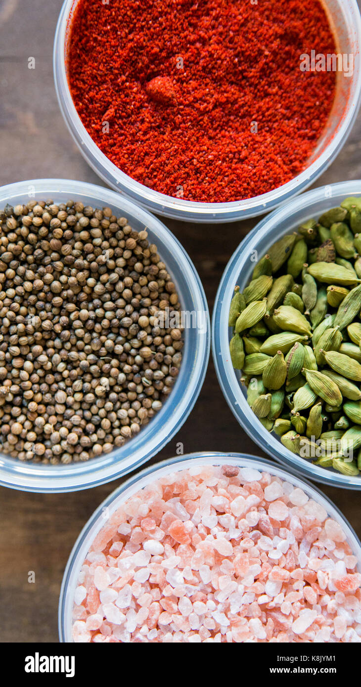 Various colorful spices in plastic containers Stock Photo Alamy