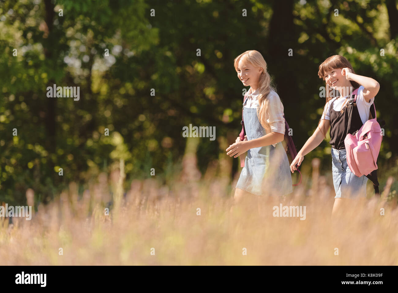 teenagers walking in park Stock Photo - Alamy