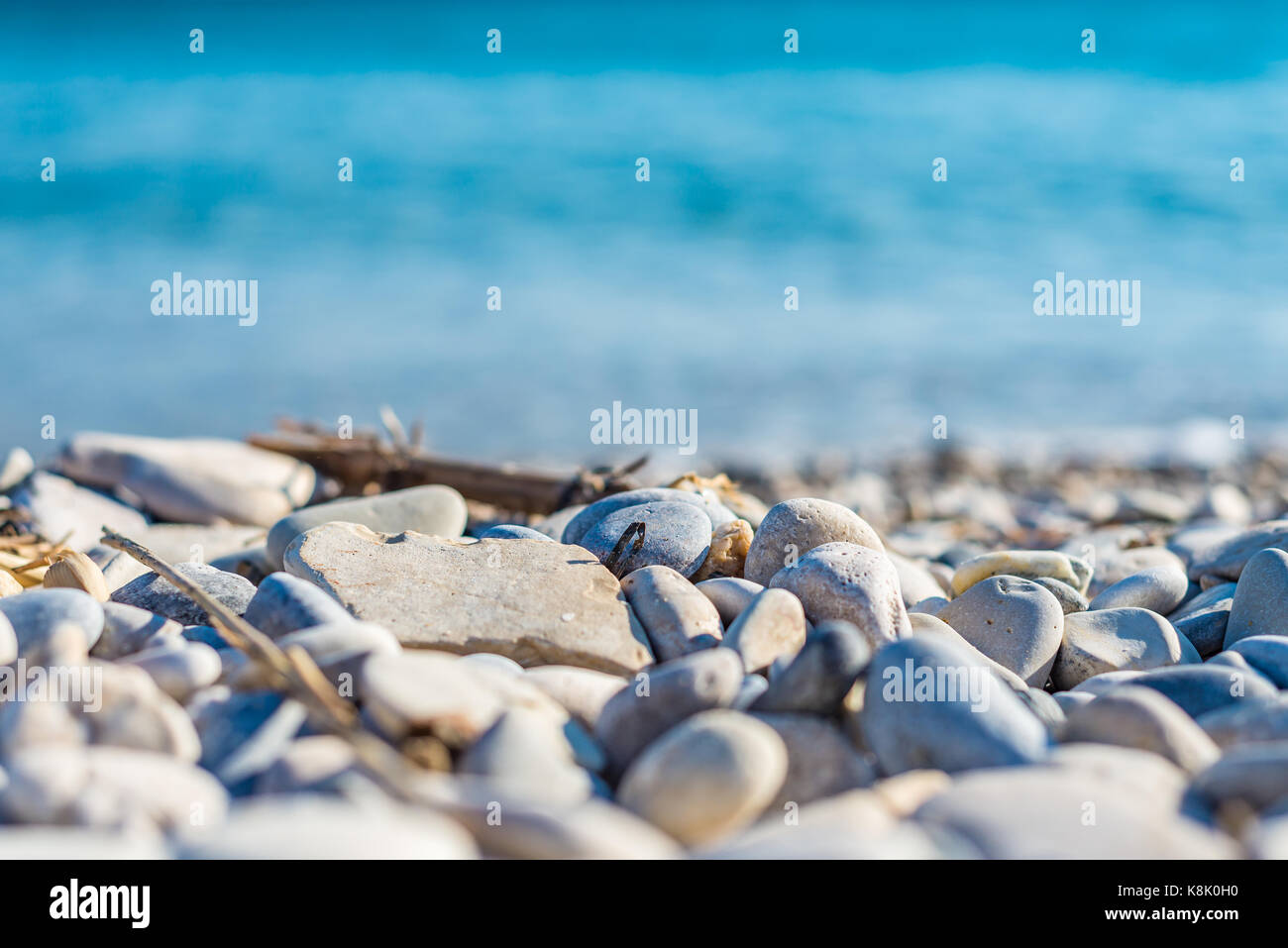 Pebbles and the sea, abstract background Stock Photo