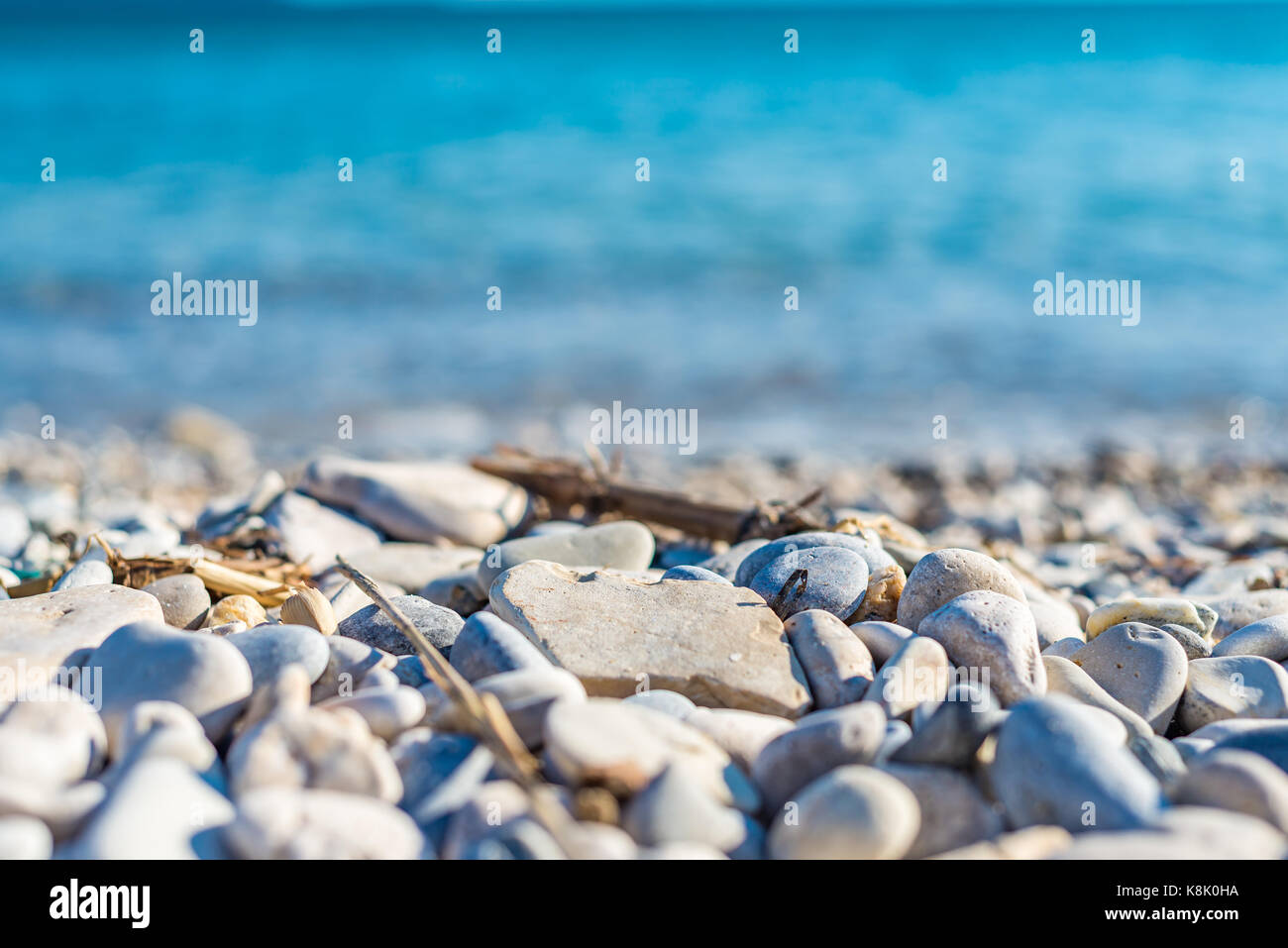 Pebbles and the sea, abstract background Stock Photo