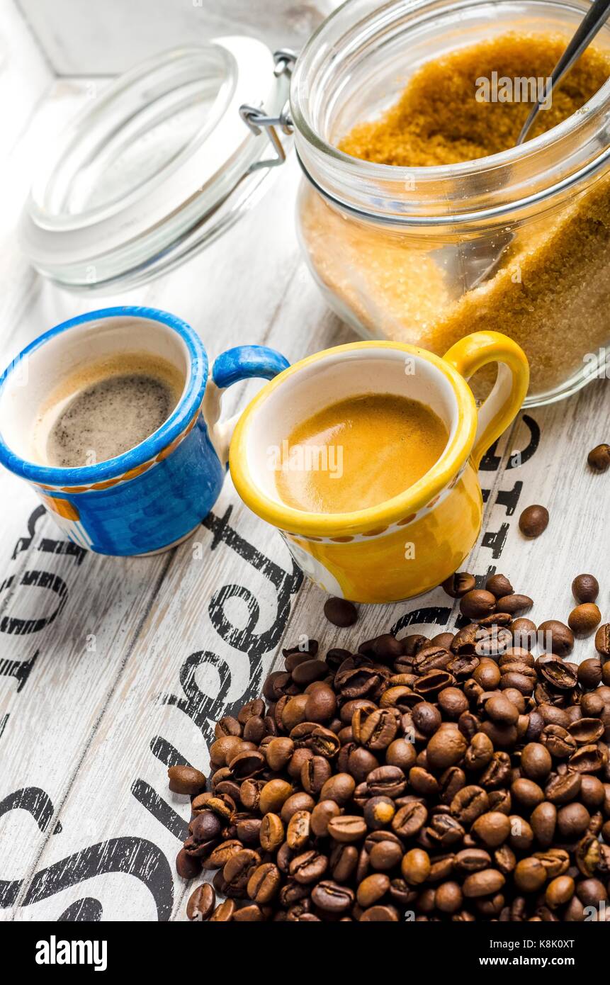 cup of coffee and coffee beans and cane sugar Stock Photo Alamy