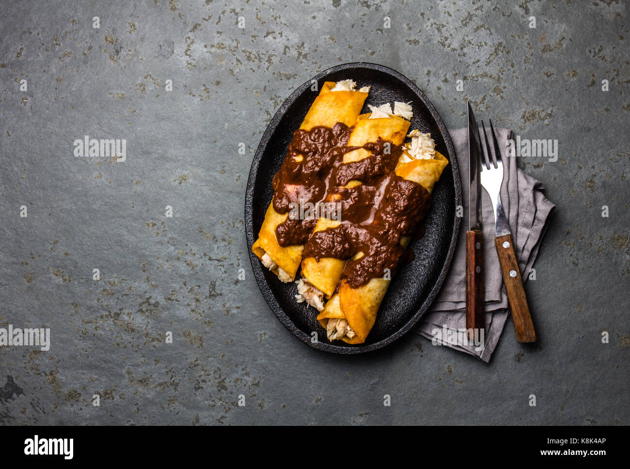 Mexican cuisine. Traditional Mexican chicken enchiladas with spicy