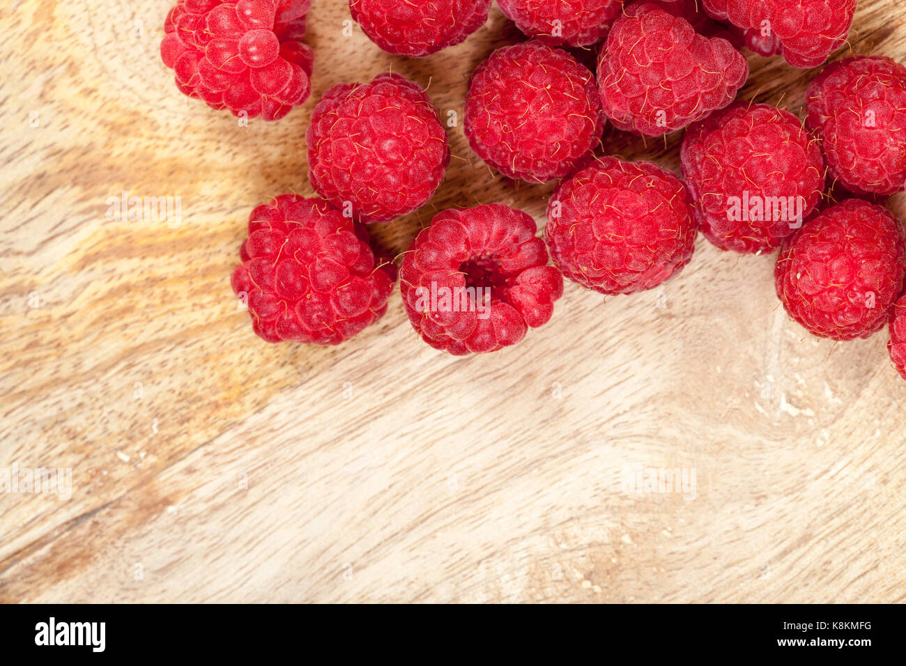 harvest red ripe wild raspberries. The photo was taken close-up, small ...