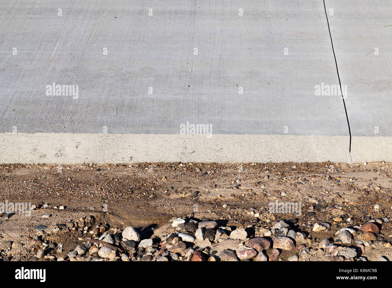 edge of a new road under construction from concrete. photo closeup at