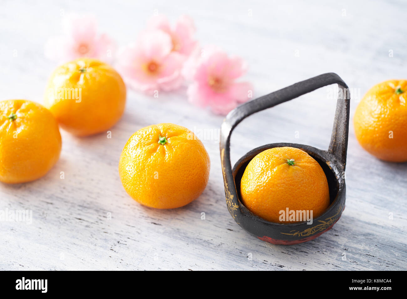 Chinese New Year - Mandarin orange on white painted wood table Stock Photo