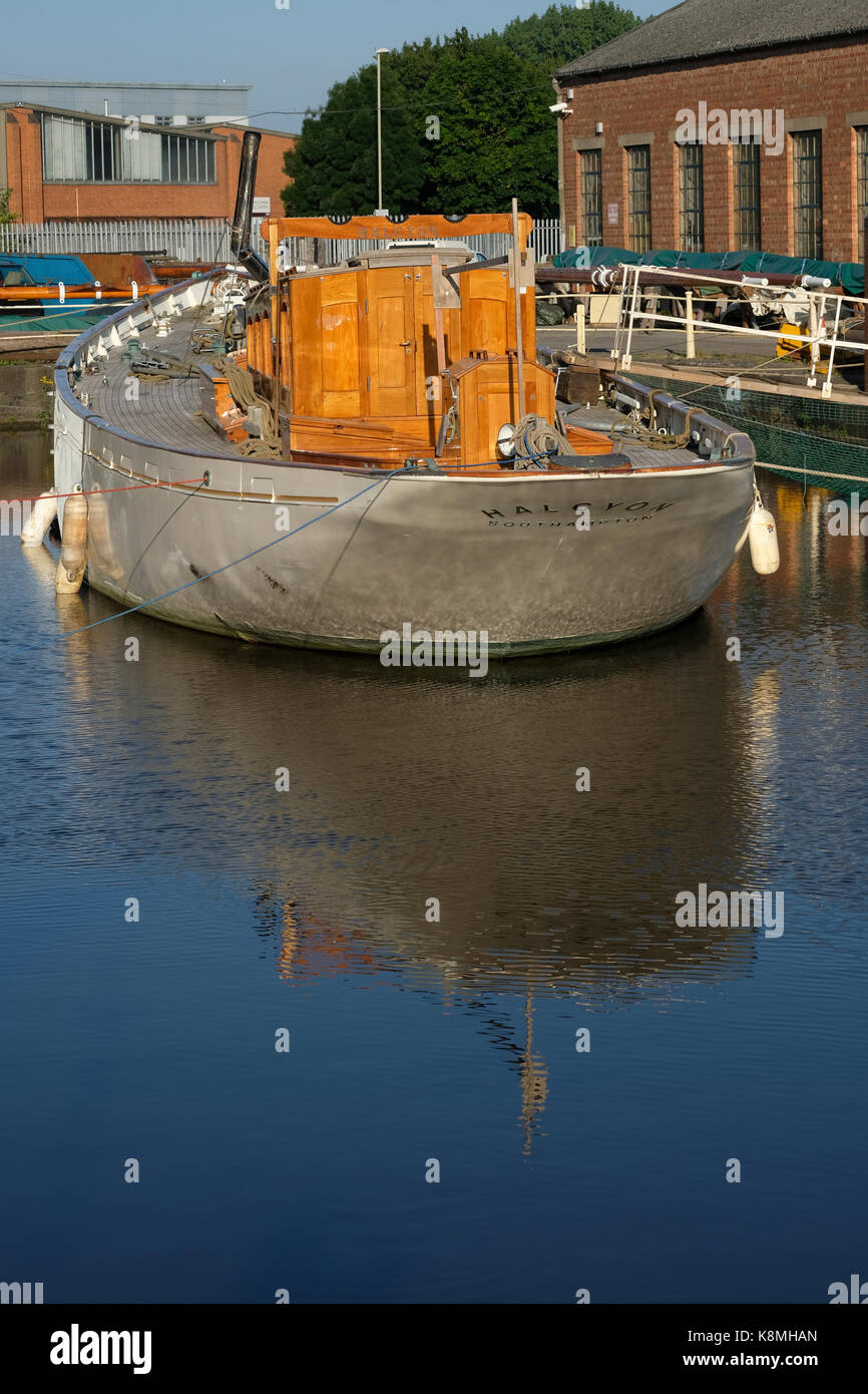 Fishing boat with a large propeller on land at a marine harbor in