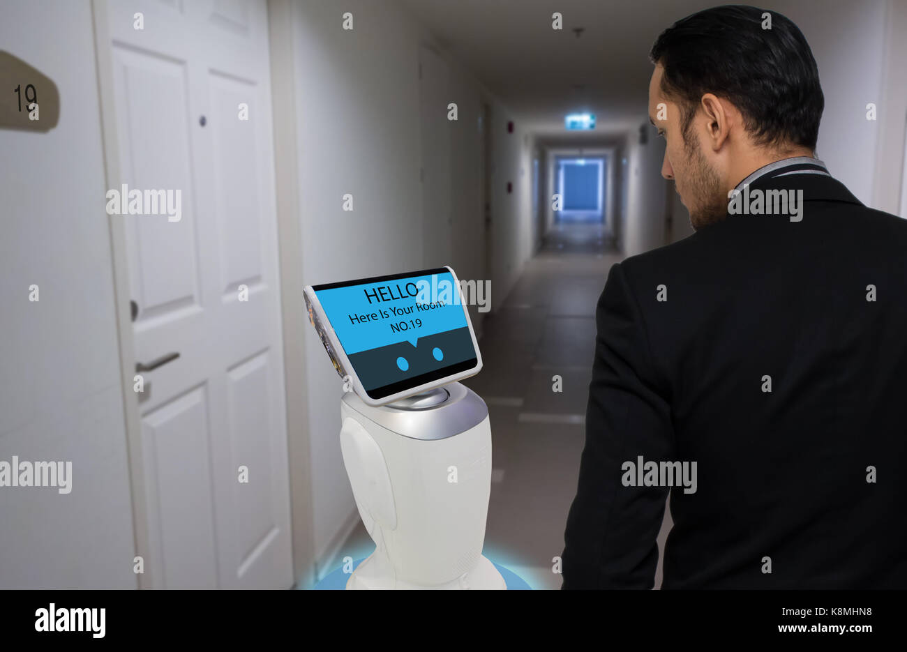 robot in hotel concept, robotic butler help the customer to the room that booking, put the object, food, accessories inside it. Stock Photo