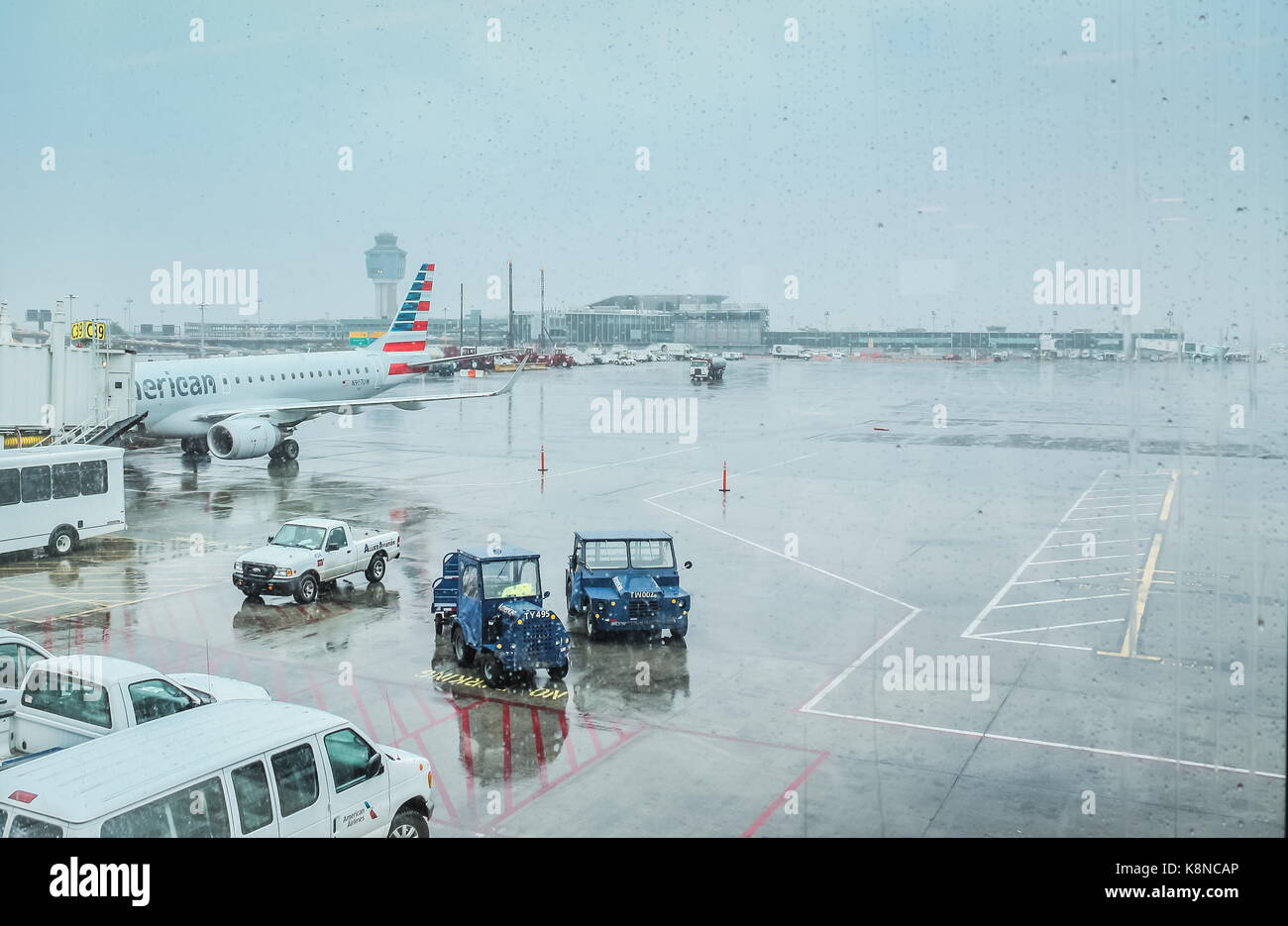 New York, USA - 30 September, 2016: View of LaGuardia Tarmac on a rainy day from inside the airport terminal. Stock Photo