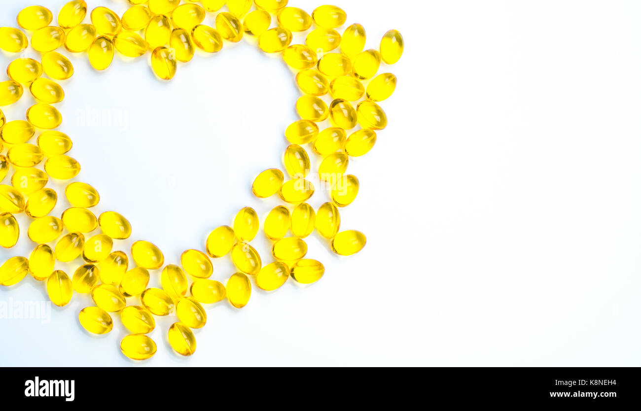 Heart shaped of cod liver oil isolated on white background with copy