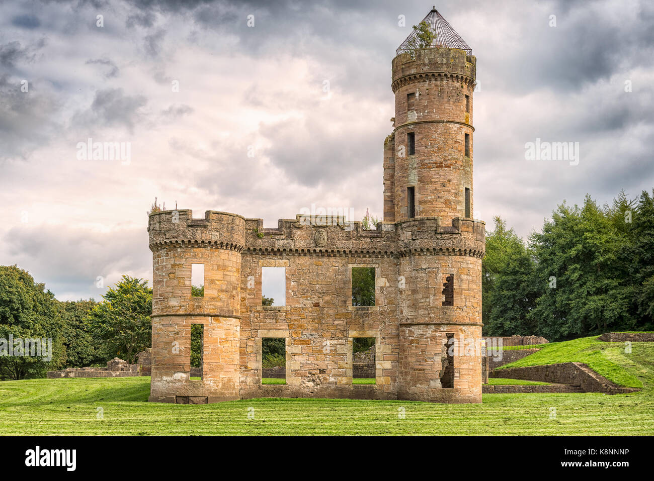 Eglinton castle Ruins taken on a cloudy day before it rained. Surrounded by trees it is situated with the Eglinton park Irvine Scotland. Image was tak Stock Photo