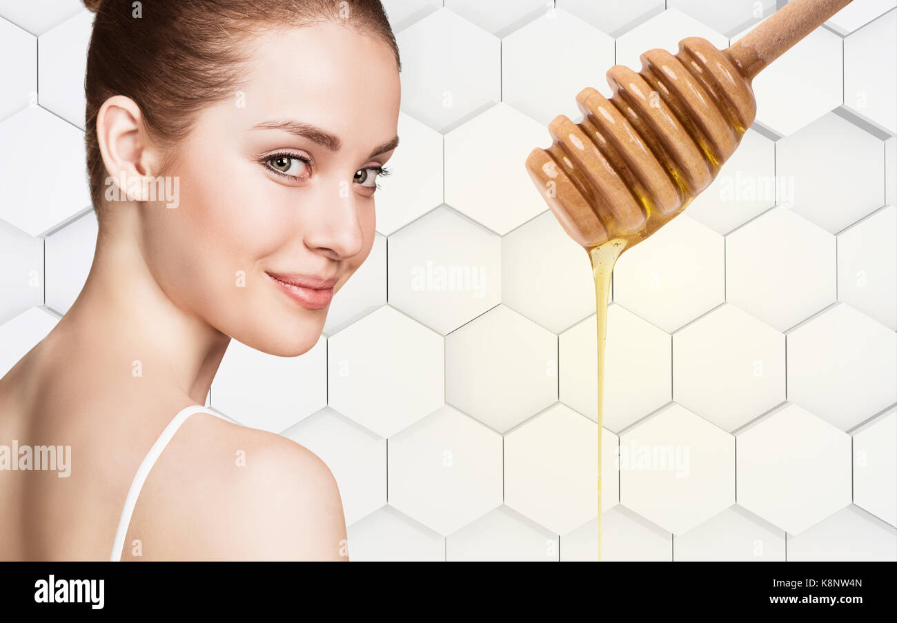 Young woman prepare for honey facial mask. Stock Photo
