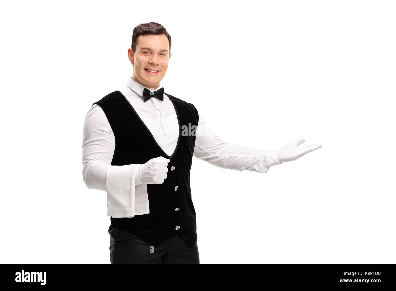 Waiter gesturing with his hand isolated on white background Stock Photo