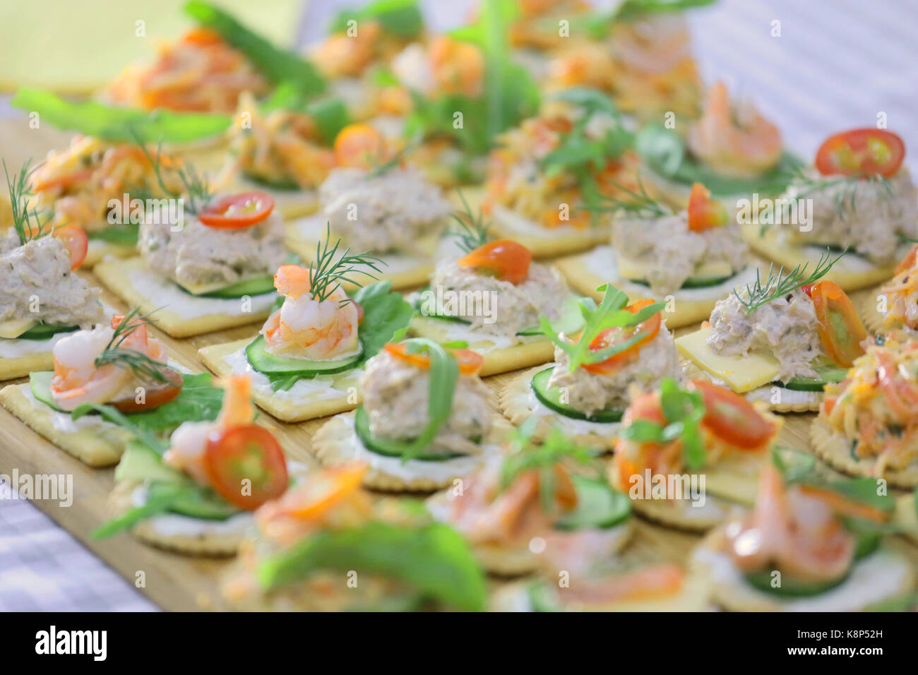 canape topping with tuna, shrimp, salmon and cheese Stock Photo - Alamy