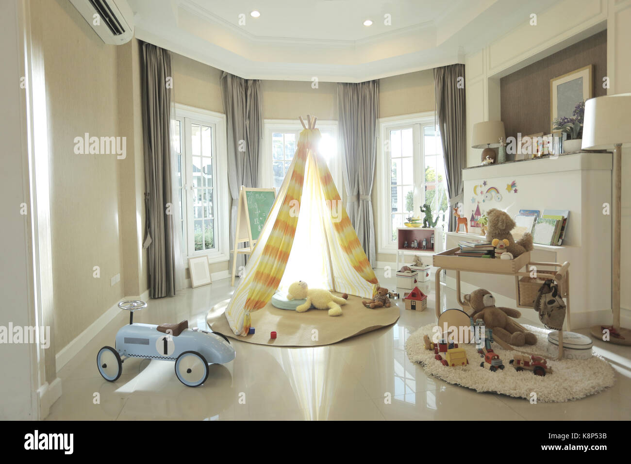 tent, dolls and alot of toys in the children room of happy home Stock Photo