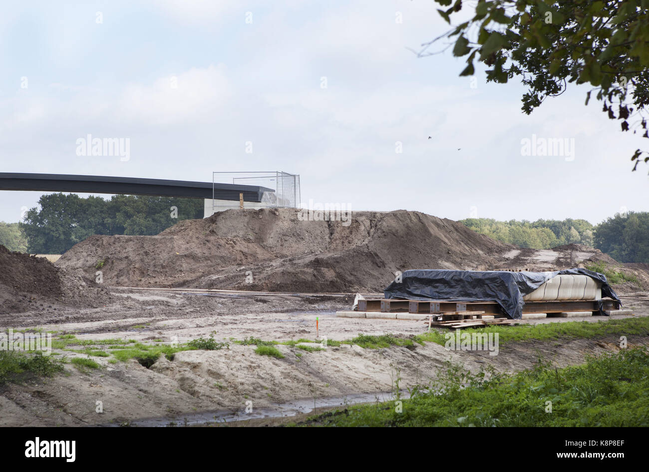 September 19, 2017 - Gemert, Noord-Brabant, Netherlands - The Netherlands, Gemert. Today, the first 3D-printed bike bridge in the world was placed. The town  Gemert-Bakel had a world scoop here. The first printed bicycle bridge in the world consists of 800 layers of concrete mortar, is 8 meters long and is placed over the â€˜Peelse Loopâ€™, a little river in this town. The bridge was printed layer by layer on a concrete printer by employees of the Technical University in Eindhoven under the guidance of Professor Theo Salet in the university laboratory. There are many advantages to this way of  Stock Photo