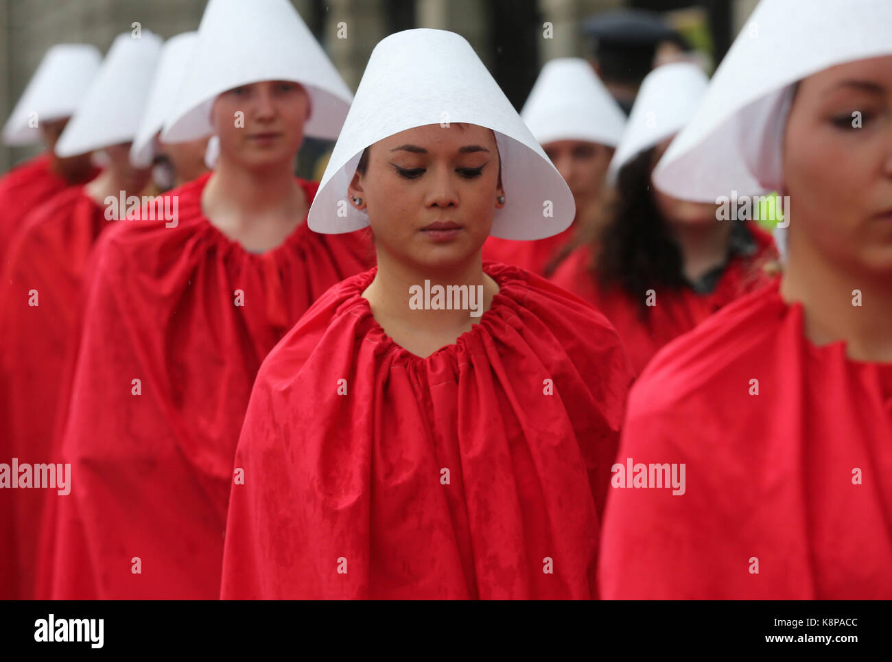Dublin, Ireland. 20th September 2017.  A group of ‘Handmaids’ are pictured outside the gates of the Irish Parliament, Leinster House, in Dublin, today as the Oireachtas Committee on the 8th Amendment starts its public sessions. The protesters are calling for full bodily autonomy for pregnant women. The protest was organised by ROSA (Reproductive rights, against Oppression, Sexism and Austerity).  Credit : Laura Hutton/Alamy Live News. Stock Photo