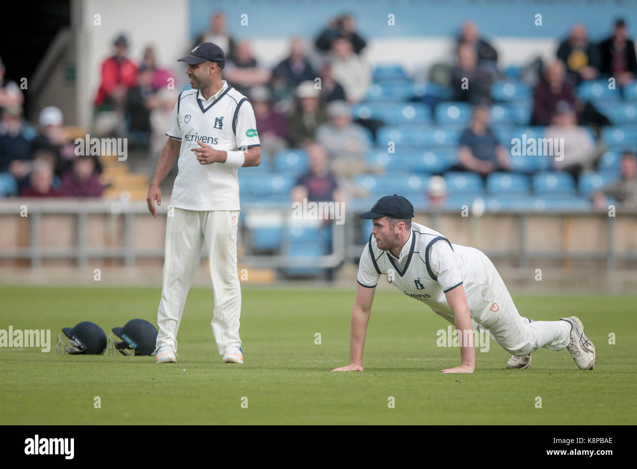 Leeds, UK. 20th Sep, 2017. Dominic Sibley (Warwickshire CCC) picks himself up off the ground having failed to stop a shot by a Yorkshire CCC player. Jeetan Patel (Warwickshire CCC) watches on. Yorkshire CCC v Warwickshire CCC on Wednesday 21 September 2017 at Headingley. Photo by Mark P Doherty. Credit: Caught Light Photography Limited/Alamy Live News Stock Photo
