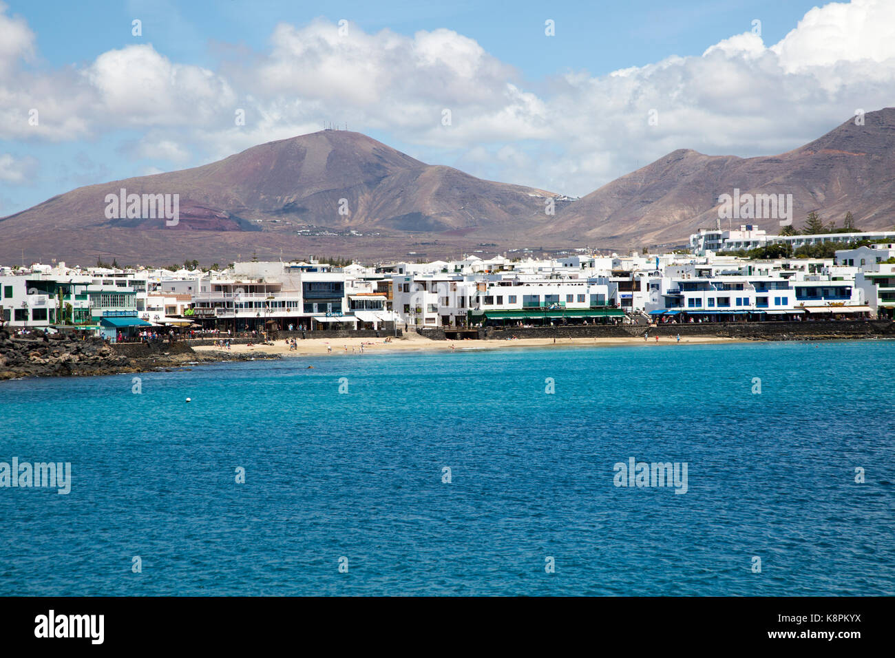 Sandy beach and buildings in Playa Blanca, Lanzarote, Canary Islands, Spain Stock Photo