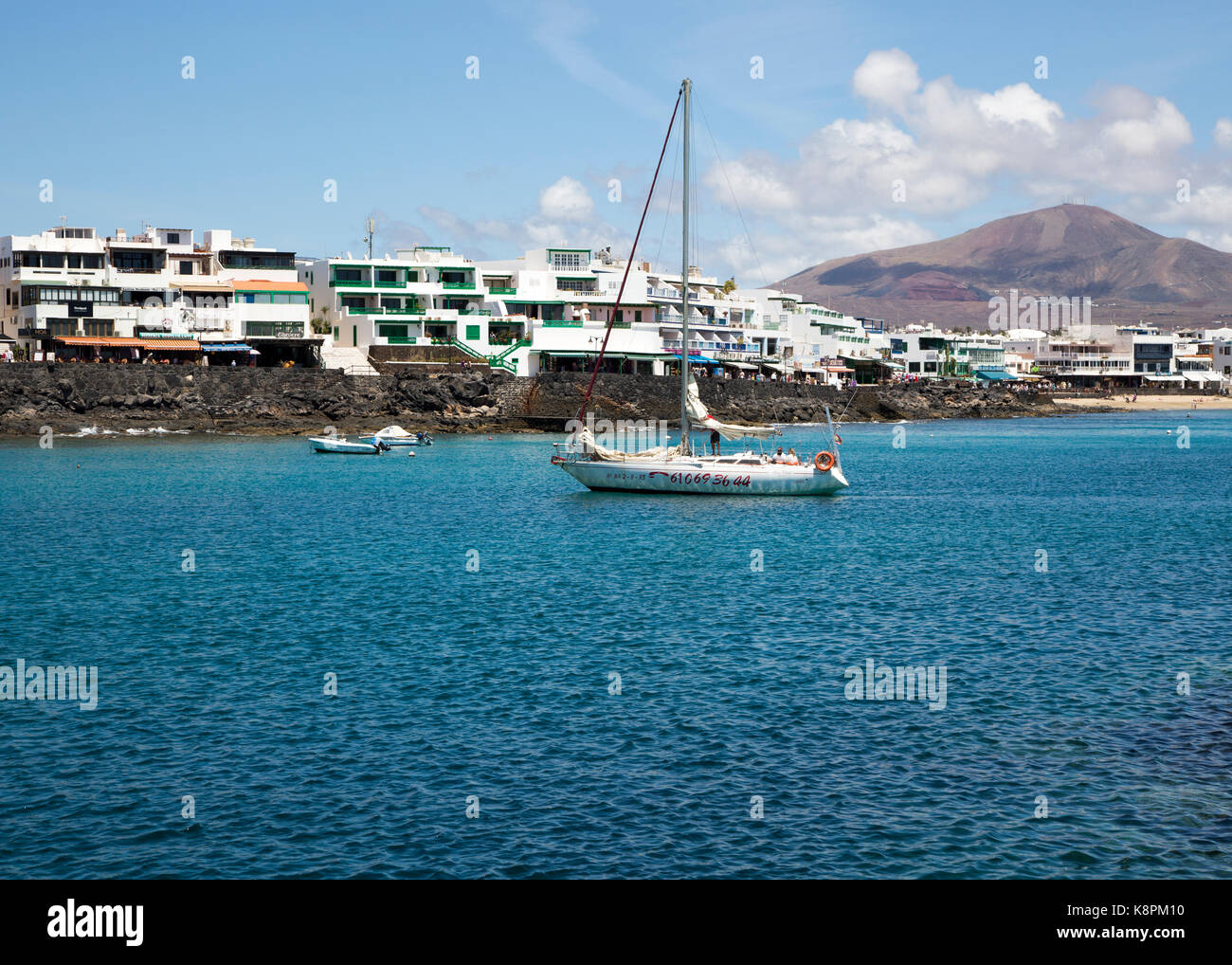 Yacht arriving in harbour at Playa Blanca, Lanzarote, Canary Islands, Spain Stock Photo