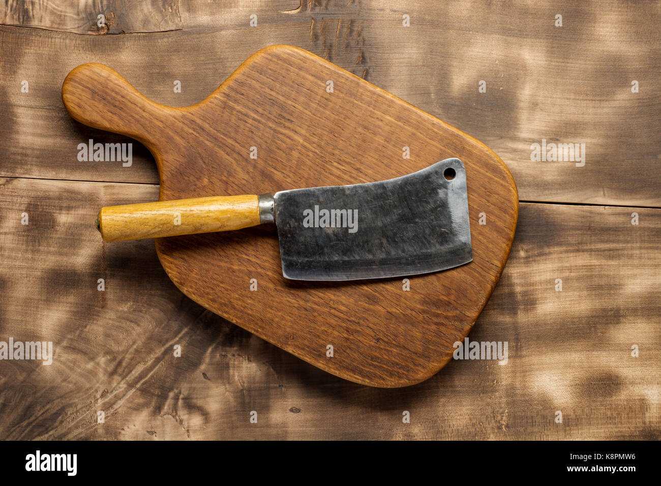 Butcher. Vintage butcher meat cleavers with chopping board on dark