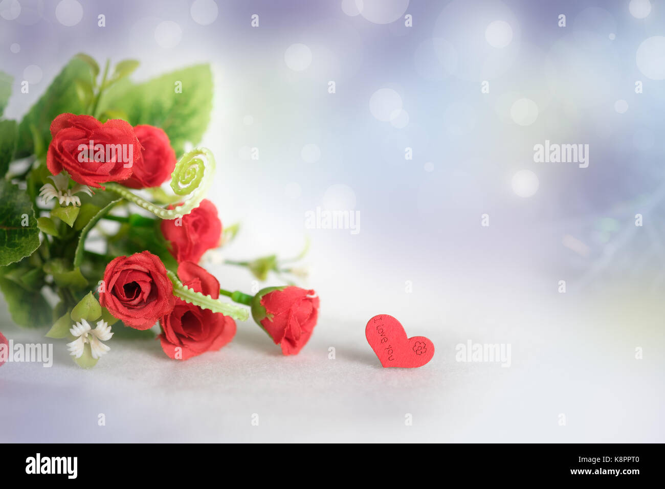 The Red Rose On Abstract Bokeh Background In Love Concept For