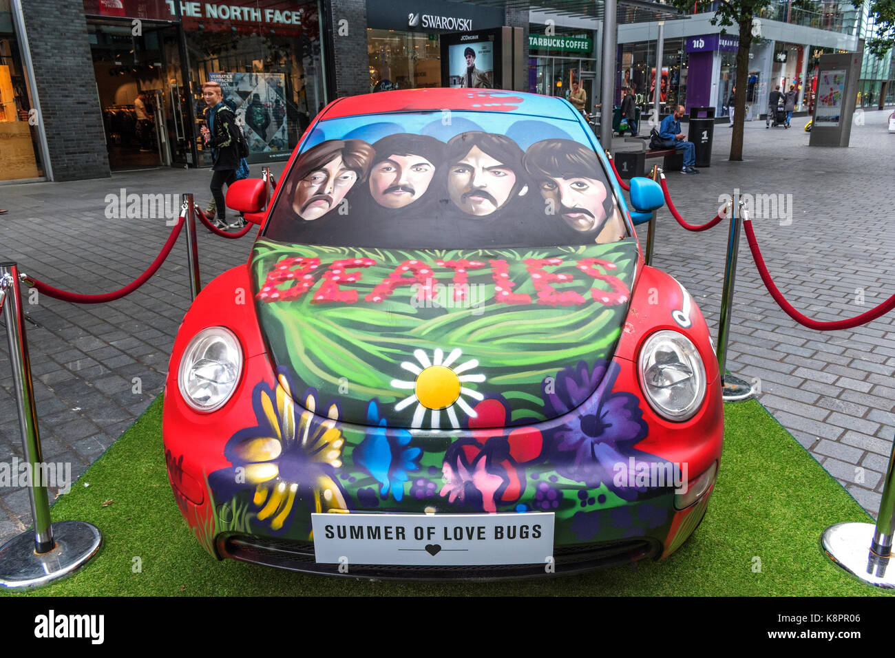 summer of love bugs in liverpool, england, uk, vw beetle painted to celebrate 50 years of the summer of love and the release of the beatles sgt, peppe Stock Photo